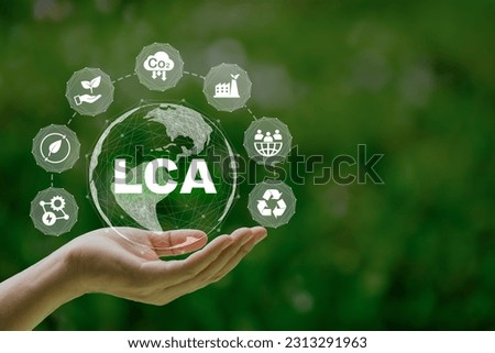 LCA, Life cycle assessment concept in hand. ISO LCA standard aims to limit climate change. Methodology for assessing environmental impacts associated on value chain product. Royalty-Free Stock Photo #2313291963
