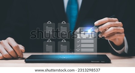 Auditor checking office documents ,Management of important document storage of organization ,ERP document system ,accountant Audit documents , quality assessment  With a checklist ,online database