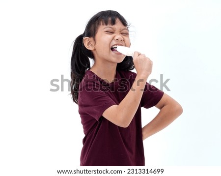 Cute little girl with delicious ice cream on white background