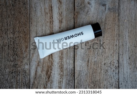  White cosmetic tube pack Of Cream Or Gel. on wooden Table background.