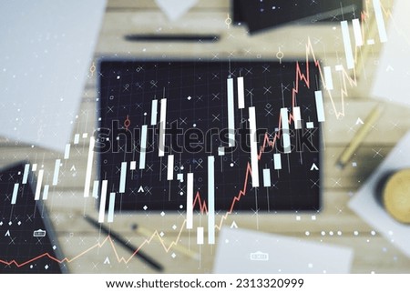 Multi exposure of abstract creative financial chart and digital tablet on background, top view, research and analytics concept
