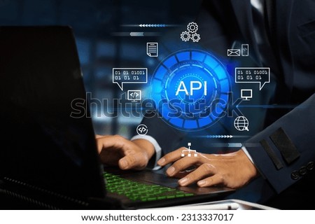 The API  (application programming interface) provides the interface for communication between applications, simplifying application integration. Royalty-Free Stock Photo #2313337017