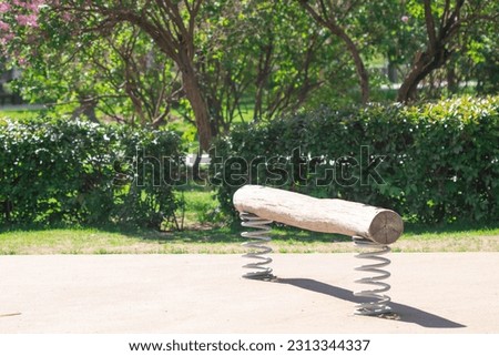 Climbing equipment on the playground. Log for climbing on the playground. Royalty-Free Stock Photo #2313344337