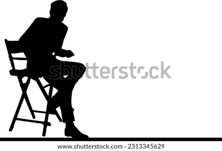 Silhouette of a director in a sitting pose on a director's chair, Director chair silhouette: Director sitting in commanding pose Royalty-Free Stock Photo #2313345629