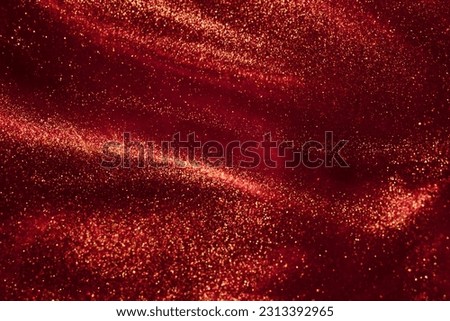 Magic Galaxy of golden dust particles in red fluid. Various stains and overflows of gold particles with burgundy tints. Fantastically beautiful abstract background. Royalty-Free Stock Photo #2313392965