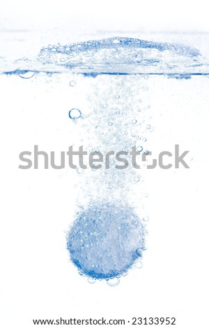 Fizzy antacid tablet in water