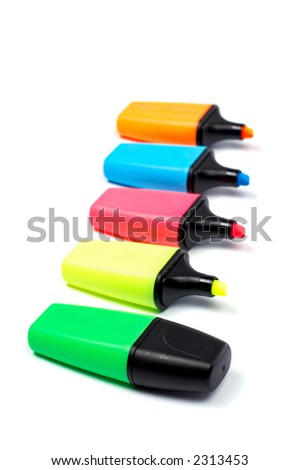Assortment of coloured labellers with shadow on white background. Small depth of field