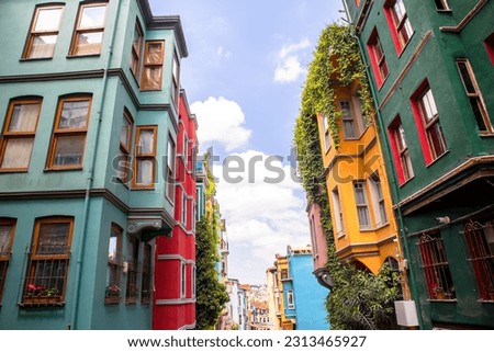 Balat Colourfull Historical Houses, Narrow Streets, Hanging Laundry Between Apartments, Ottoman Era in Istanbul, Turkey. Royalty-Free Stock Photo #2313465927
