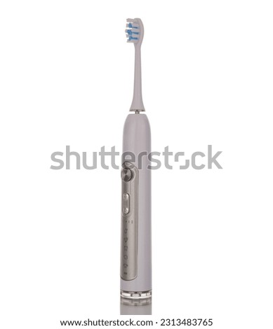 One electric toothbrush, macro, isolated on a white background.