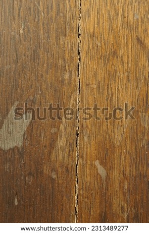a wooden plank with a crack in the middle, abstract background