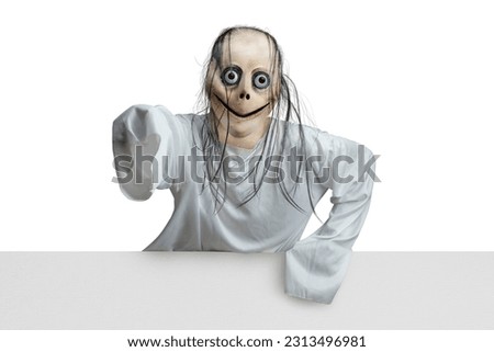 Scary Momo standing behind the wall on white background. Scary face for Halloween decoration