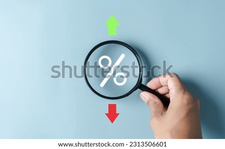 Magnifier focus to percentage icon inside for Increasing and decreasing, Up and Down arrow Currency money trading exchange transfer rate.