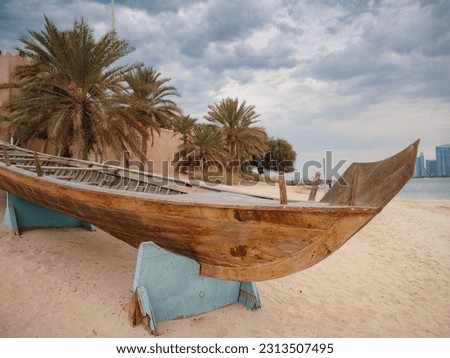Wooden boat at Heritage Village, United Arab Emirates. It is a popular tourist attraction showing life in Abu Dhabi before the oil boom.