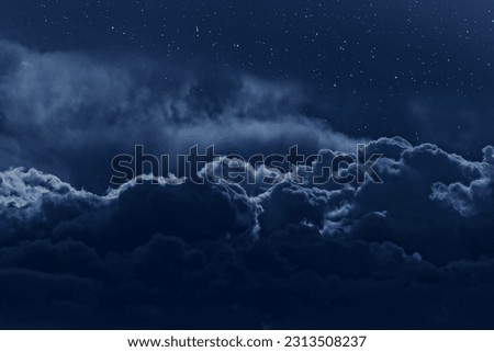 Night sky with stars and strong clouds as seen from above