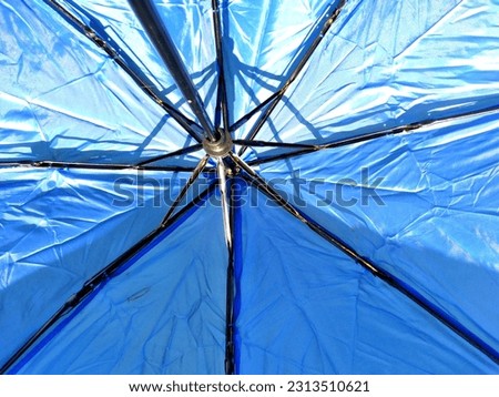 close up of upside down blue umbrella