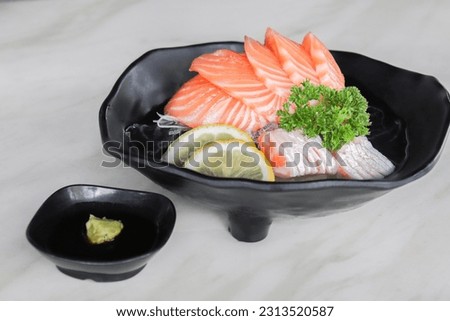 Salmon sashimi is a Japanese food that is popular in cosplay style. Asian Sashimi