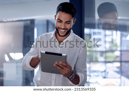 Tablet, night and research with a business man, happy while working alone in his office after hours. Technology, internet and smile with a male employee doing an online search for information or data
