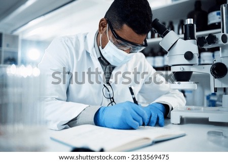 Man, scientist and writing for science research, discovery or breakthrough information and notes at lab. Male person or medical professional with notebook for scientific data or results in laboratory Royalty-Free Stock Photo #2313569475