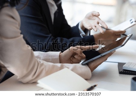 Businesswoman consultant discussing business project planning on tablet.