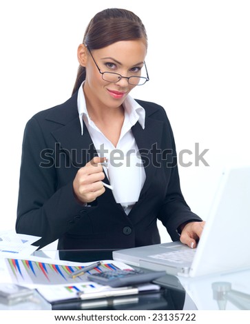 Smiling Business woman working on laptop and holding coffee cup