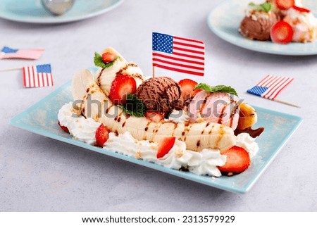 Banana split ice cream with American flag, top view Royalty-Free Stock Photo #2313579929