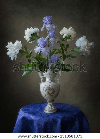 Still life with bouquet of irises and peonies