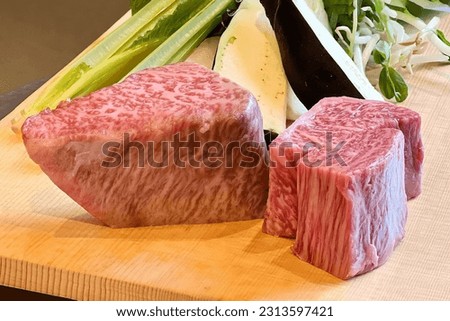 Closeup Shot of Wagyu Beef and Vegetables on A Wooden Plate. Royalty-Free Stock Photo #2313597421