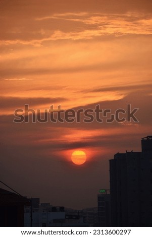 Sunset in Dhaka City Showing Labaid in pictures Translation = Labaid
