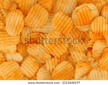 Potato chips with bbq sauce. Background and texture. Full frame. Royalty-Free Stock Photo #2313648197