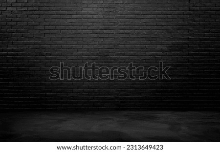 industrial background for product displayed. black brick wall background, rough concrete, plastered concrete floor, with lights from above. lighting effect on empty brick wall background for design. Royalty-Free Stock Photo #2313649423