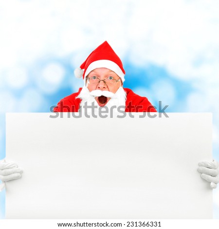 Santa Claus with Blank Board on the Winter Background
