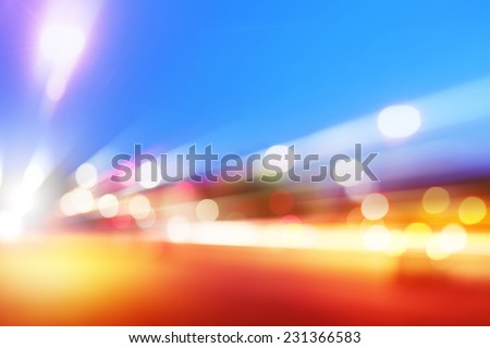 Abstract image of car lights in motion at dusk.