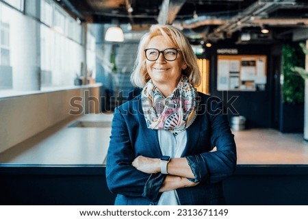 Portrait of smiling 50's stylish, confident mature businesswoman, middle aged company ceo director, experienced senior female professional, business coach team leader in modern office. Female leader. Royalty-Free Stock Photo #2313671149