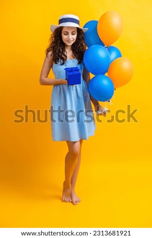 birthday woman with gift balloons in studio. birthday woman with gift balloons