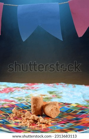 Festa Junina party background with peanuts and traditional sweets. Brazilian summer harvest festival concept. flags and typical foods