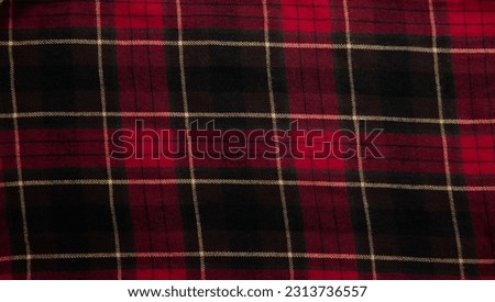 Checkered fabric, plaid. Fabric geometric background, retro textile design. Red, black chess with yellow lines.