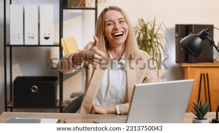 Happy amazed young businesswoman working on laptop shocked by sudden victory, game winning, lottery goal achievemen, good career news. Excited manager woman freelancer at home office workplace desk Royalty-Free Stock Photo #2313750043