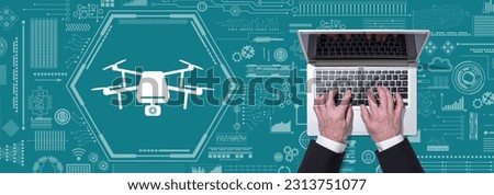 Top view of hands using laptop with symbol of drone concept