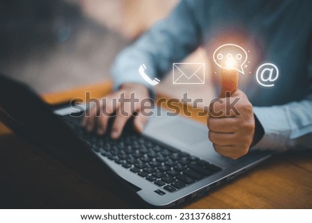 Businessman using Smart Phone with the email, call phone, address, Chat message icons.Customer support hotline Contact us people connection.
