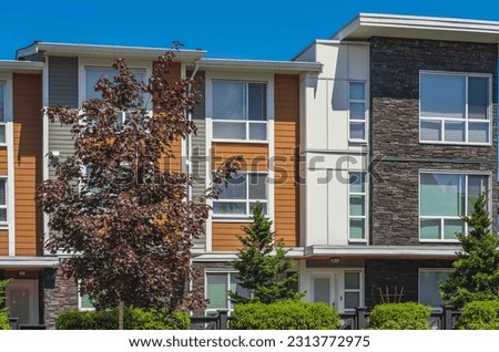 New Modern Apartment Buildings in Vancouver BC. Canadian modern residential architecture on sunny summer day. Nobody, street photo-Vancouver BC. Real estate development, house for sale, housing market