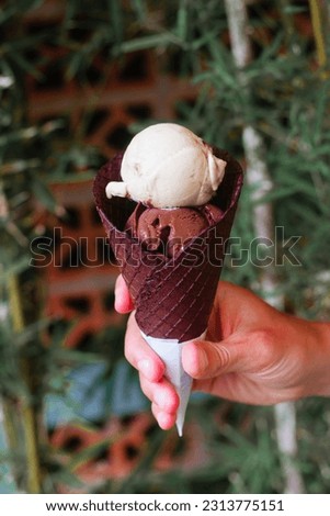 Ice cream in a chocolate cone in summer