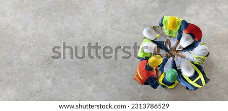 Top view of engineer, architect, contractor and foreman having unity agreement meeting at the construction building site with floor plan for real estate development project industry and housing usage Royalty-Free Stock Photo #2313786529