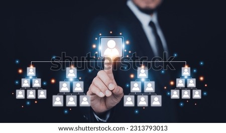 Business team management concept, Businessman touch  visual screen for organization group of employee manage manpower to success in business strategy. Leader project team management,HR human resource Royalty-Free Stock Photo #2313793013