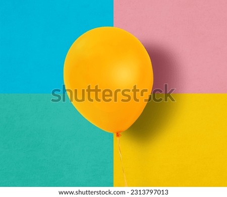 Orange balloon on colorful background