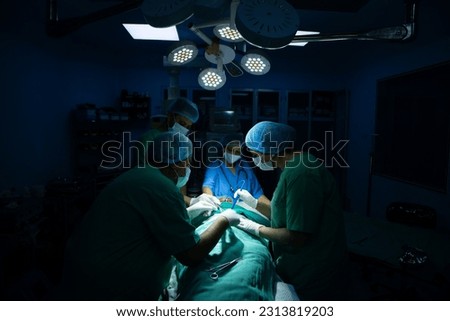 indian surgeons medical team performing surgery in operation theater at hospital. Medical care concept. Royalty-Free Stock Photo #2313819203