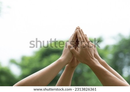 Group of volunteers joins hands together concept, Volunteer charity work. Power of male and female volunteer charity work. sustainable development goal.World environment day global community teamwork Royalty-Free Stock Photo #2313826361