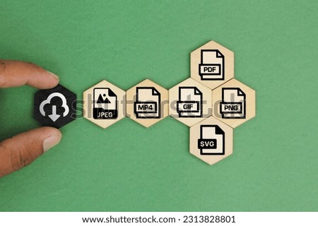 wooden box with save file icon or download file format JPEG, PNG, GIF, PDF, SVG And MP4 file. file icons are arranged into folders. Concept document management system or DMS. Royalty-Free Stock Photo #2313828801