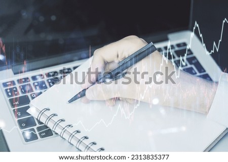 Multi exposure of abstract financial diagram with hand writing in notepad on background, banking and accounting concept