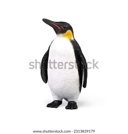 Miniature toy penguin animal decoration on white background