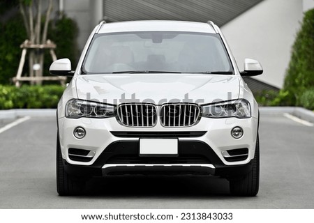white car front view See clearly, double headlights, hood. Royalty-Free Stock Photo #2313843033